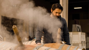 Eric Johnson working in the barrel room of winery