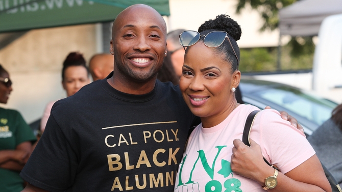 Alumni couple smiling for the camera.