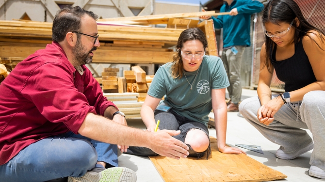 Cal Poly Architecture and Design professor working with students. 