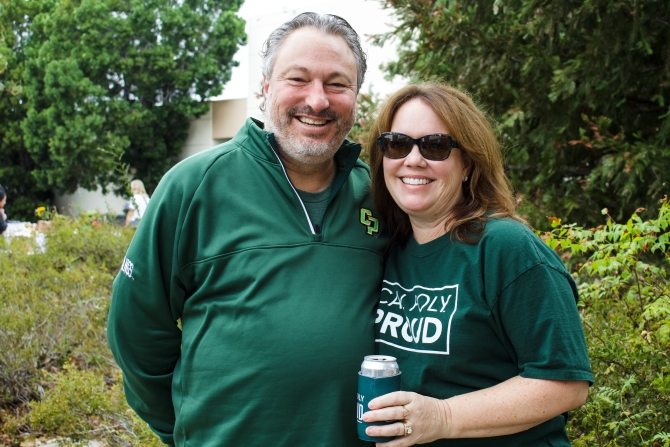 Alumni smiling for the camera.