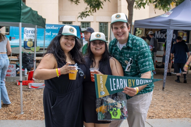 Cal Poly Alumni smiling for the camera 