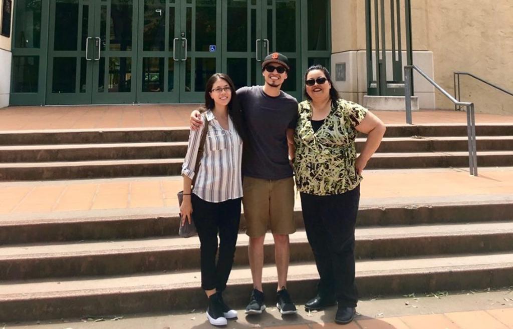Brenda, Ernest and Lorraine Lopez pose on campus