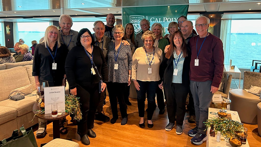 Group of Cal Poly alumni smiling for the camera.