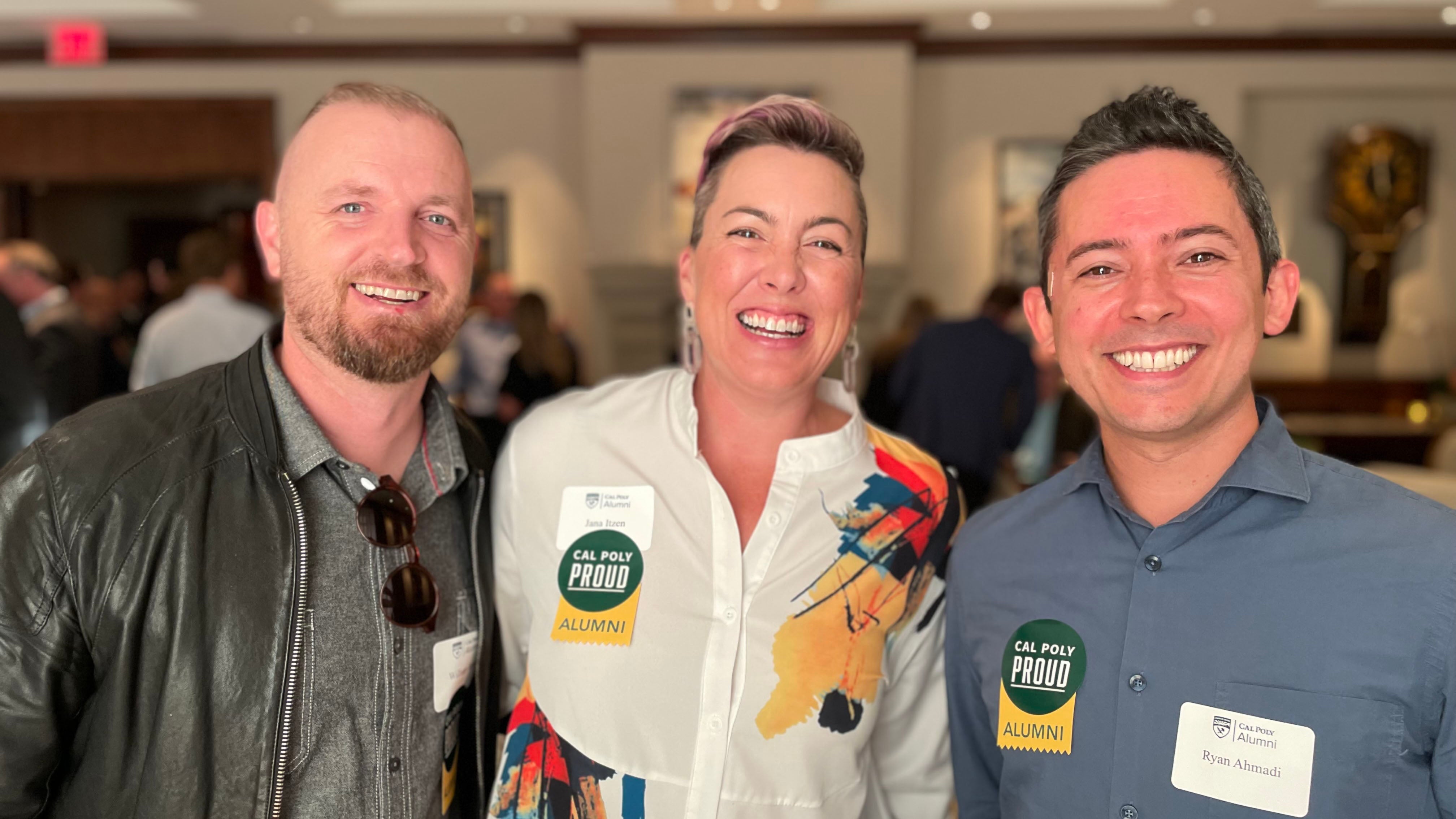 Alumni smiling for the camera