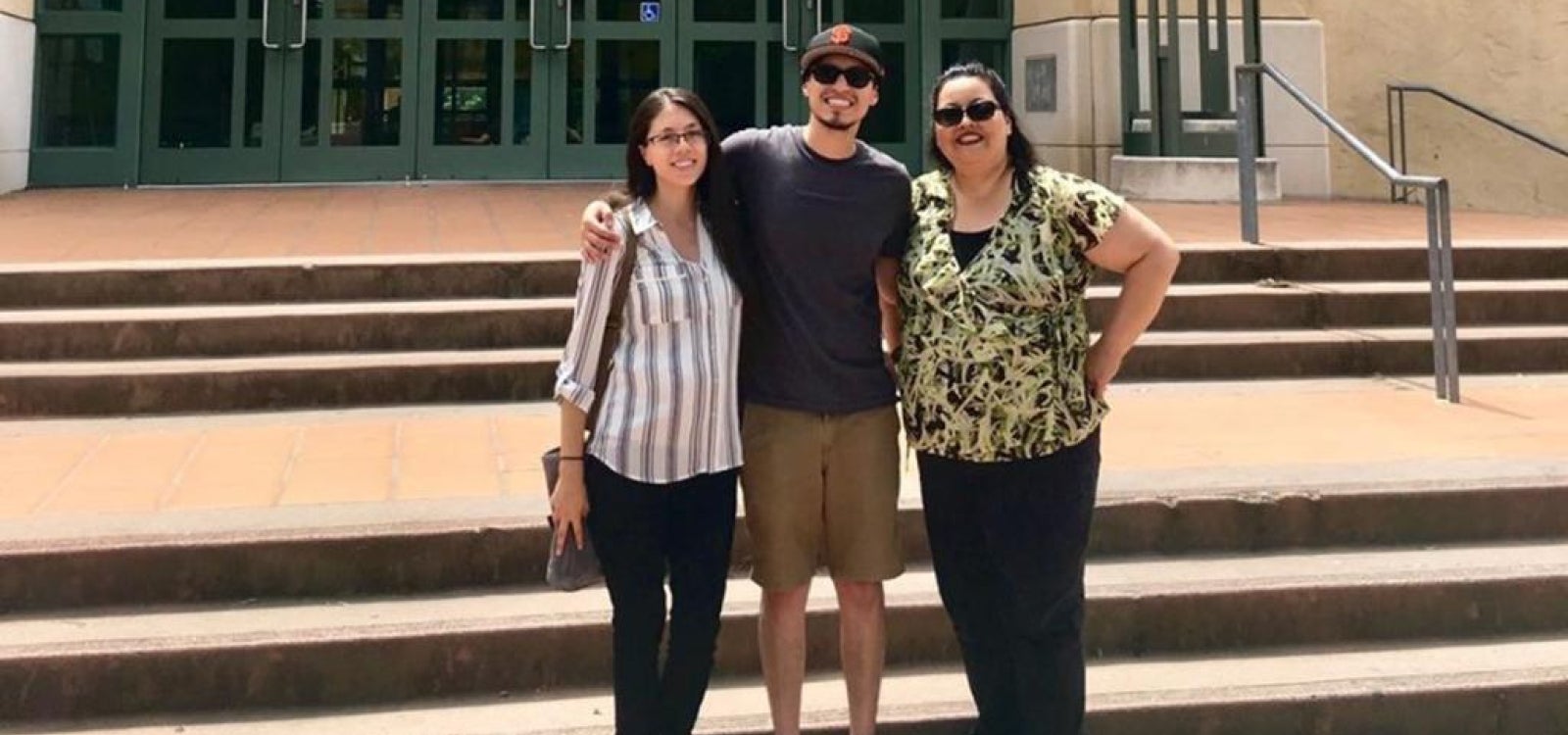 Brenda, Ernest and Lorraine Lopez pose on campus 