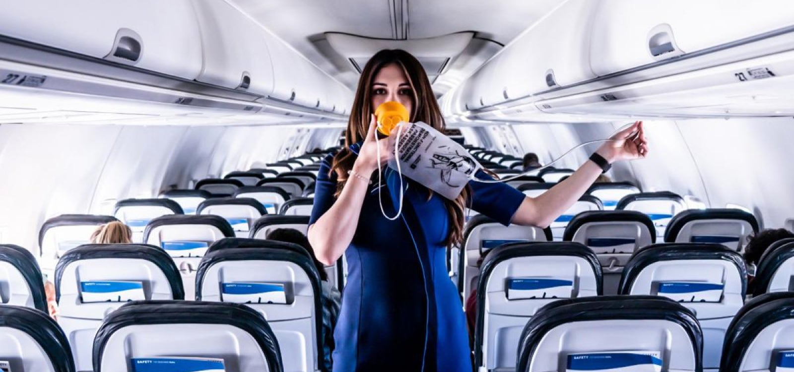 Flight-attendant-COVID-19-wearing-mask