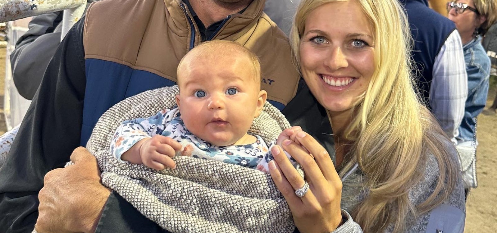 Lane and Jane Karney holding their newborn child, Charlie Hazel Karney.