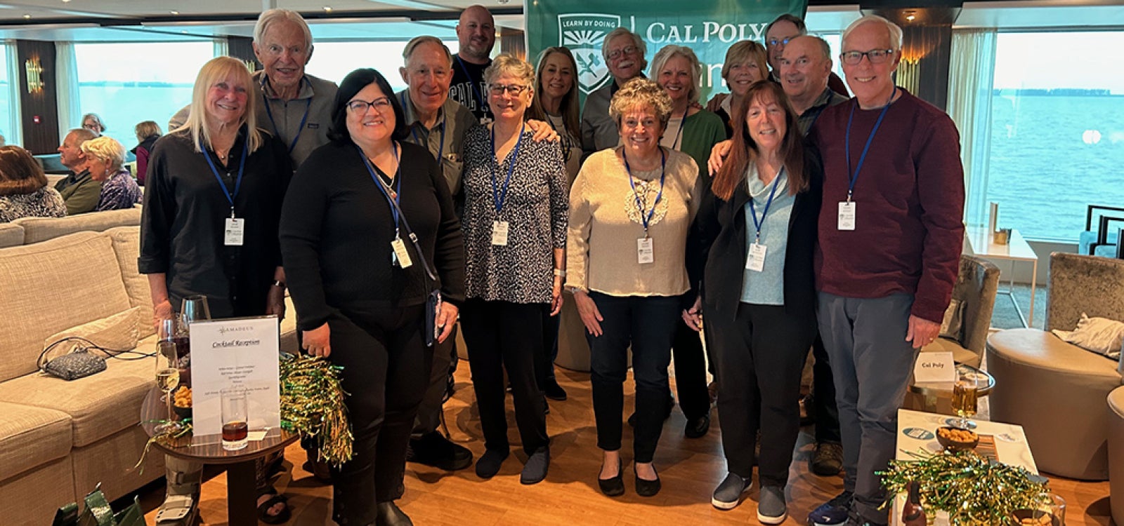 Group of Cal Poly alumni smiling for the camera. 