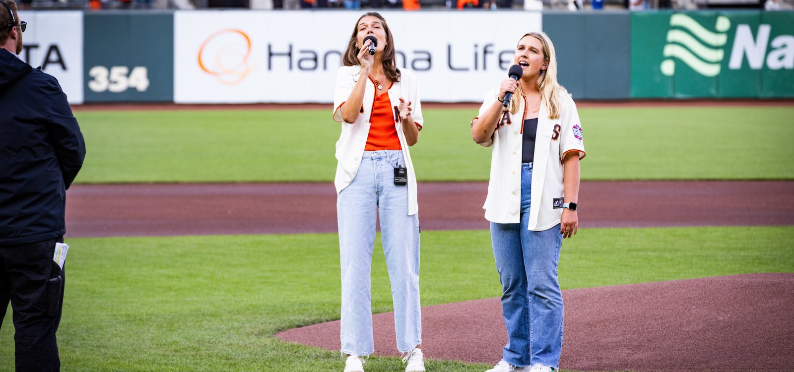 Cal Poly Beach Volleyball alumni Livy Lee and Erika  Foreman singing the national anthem.