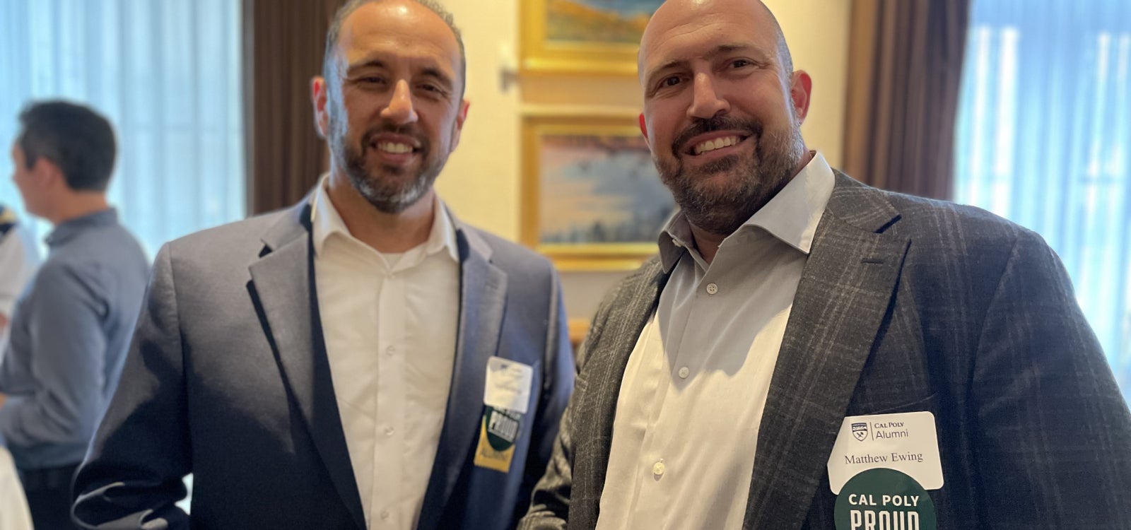 Alumni smiling for the camera