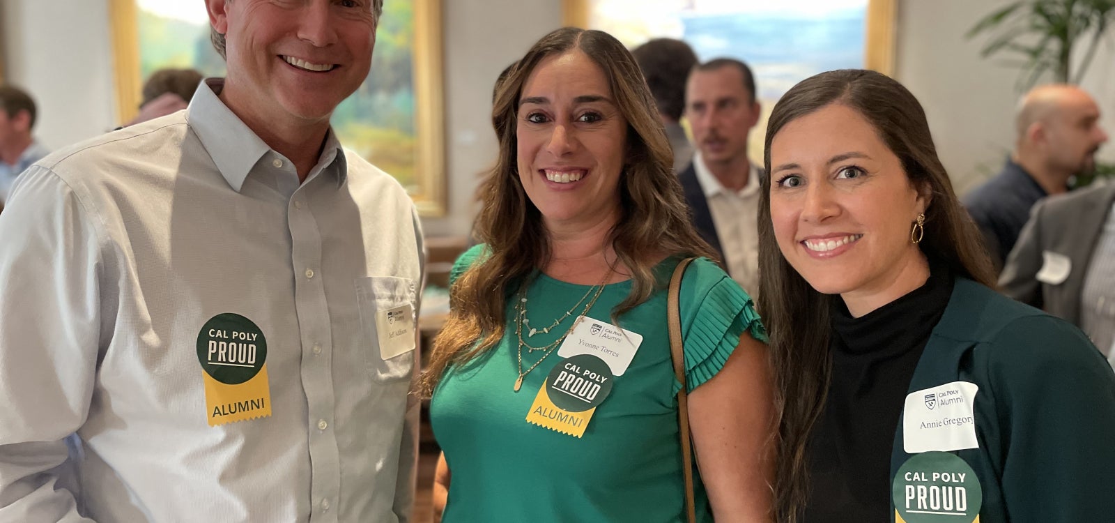 Alumni smiling for the camera