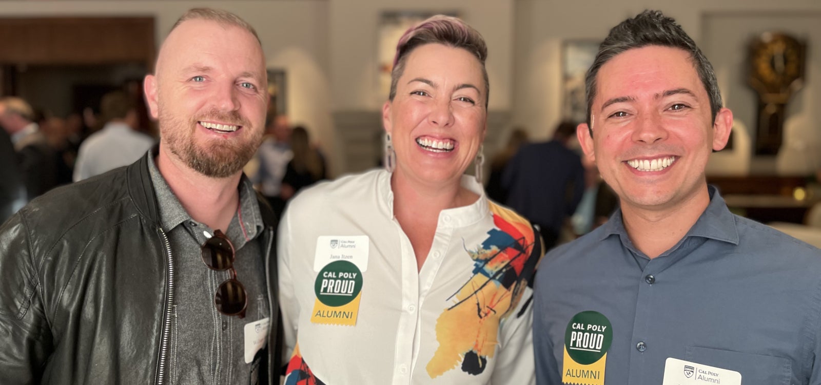 Alumni smiling for the camera