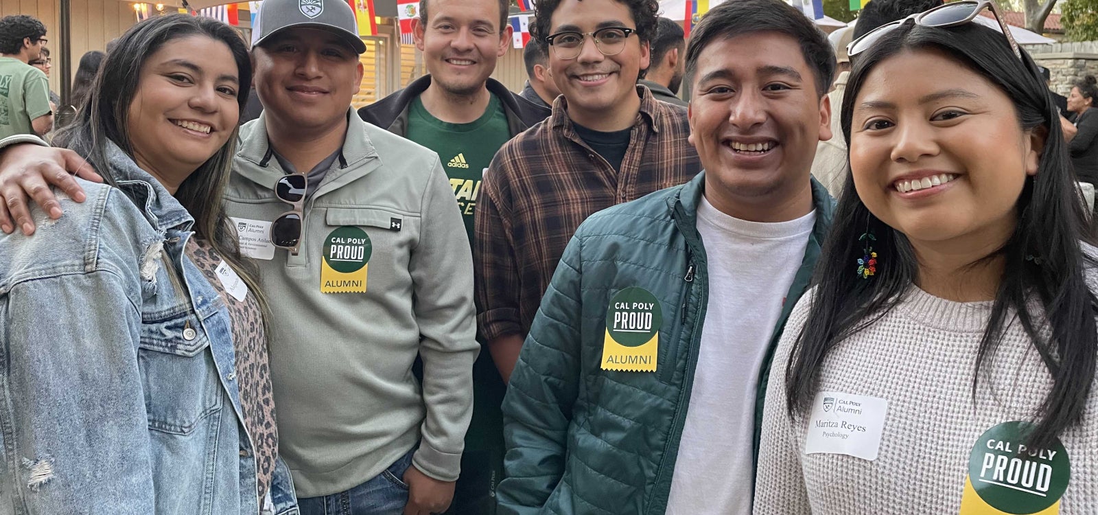 Alumni smiling for the camera