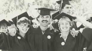 Graduates in 1985 smiling for the camera.