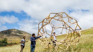 An image of students setting up the design village in Poly Canyon. 