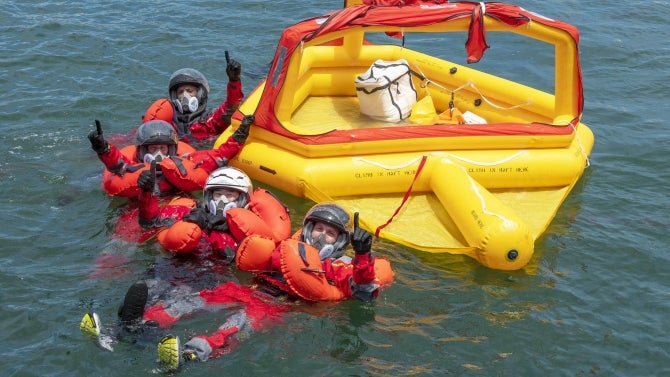 The astronauts participate in an egress training exercise which simulates an emergency situation after splashdown of the Crew Dragon spacecraft.