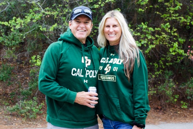 Two Cal Poly alumni smiling for the camera. 