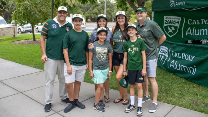 Alumni family smiling for the camera. 