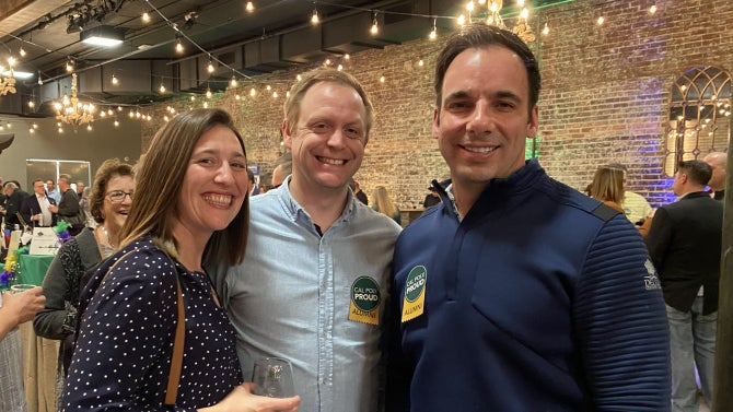 Alumni smiling for the camera