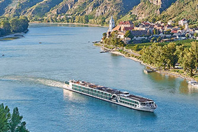 Cruise ship traveling down a river.