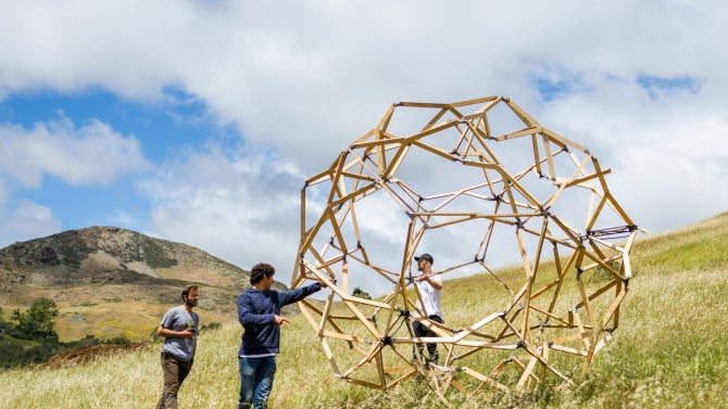 An image of students setting up the design village in Poly Canyon. 