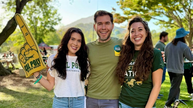 A group of Cal Poly Alumni smile for a photo. 