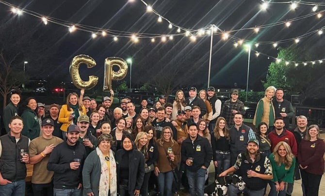 Modesto community alumni gathering for a photo at Dust Bowl Brewery. 