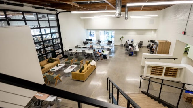 Image of the new CIE HotHouse with students working at the desks. 